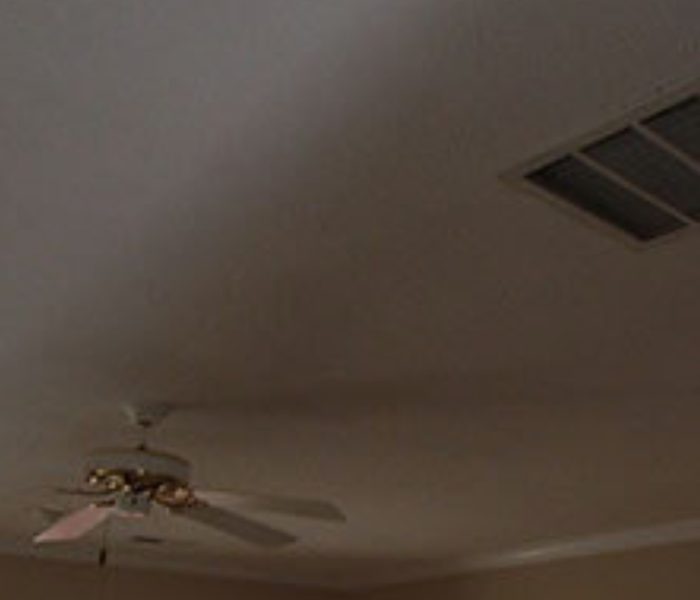 a picture of a ceiling being repaired after water damage