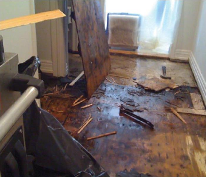 a picture of damaged hard wood floors from water