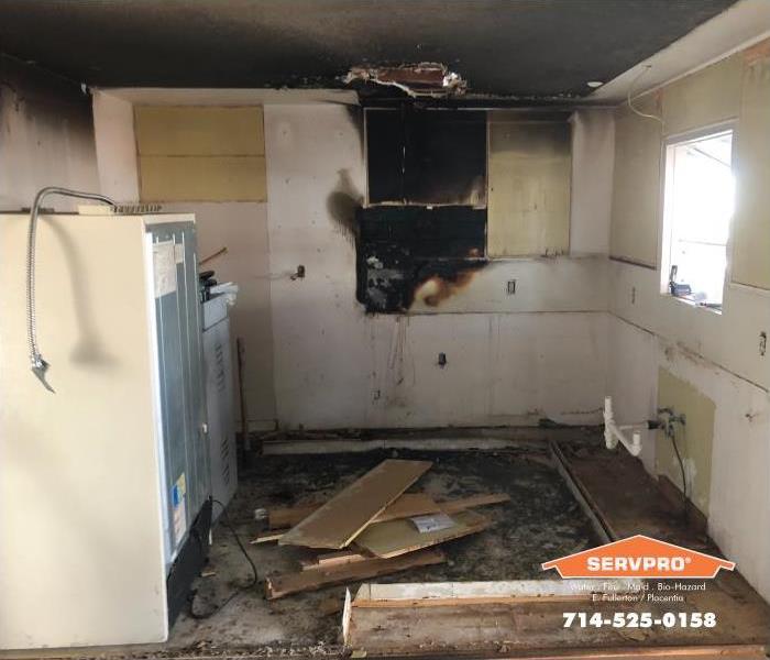 a picture of a kitchen after a fire.