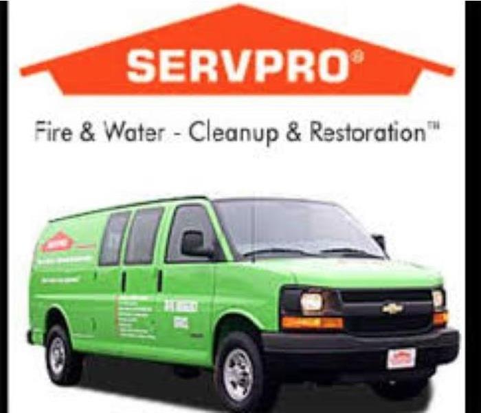 A picture of our logo and green SERVPRO van
